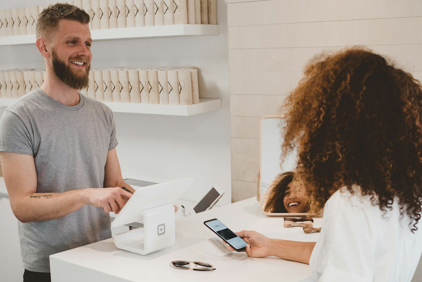 Shopkeeper billing a customer at the counter