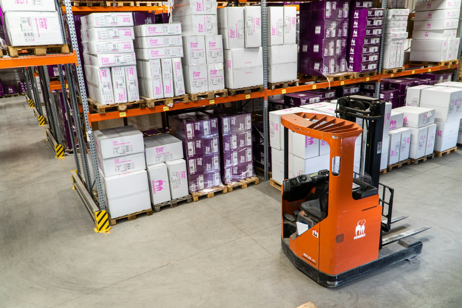 Forklift moving pallets in a warehouse